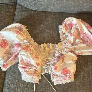 Super cute open top in the middle of the chest super girly never worn